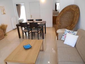 a living room with a couch and a table at Pepi Cozy in Alexandroupoli