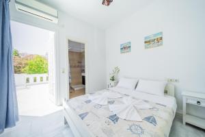 A bed or beds in a room at Agia Anna Living