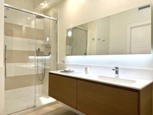 a bathroom with a sink and a shower at Starhost - CASA BONNIE, large furnished balcony on the Cathedral and a stone's throw from seafront, beach and ferry's pier in Minori +31 photos