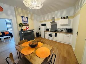 a kitchen and dining room with a table and chairs at City center Centre Ville, WIFI, 4 personnes Max in Épernay