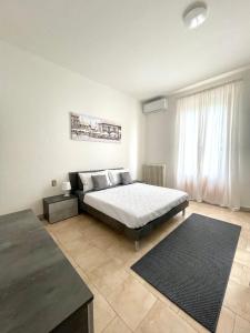 Postel nebo postele na pokoji v ubytování Appartamento Aurora Empoli - Firenze