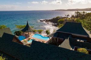 an aerial view of a resort by the ocean at Ohana Villa, Tobago in Scarborough