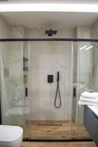 a shower with a glass door in a bathroom at AMarescaladeiturchy Valle dei templi in Realmonte +12 photos