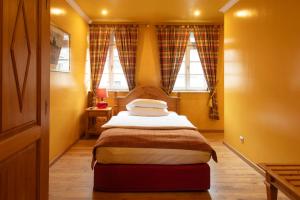 Postel nebo postele na pokoji v ubytování Werners Boutique Hotel