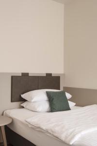 Postel nebo postele na pokoji v ubytování Werners Boutique Hotel