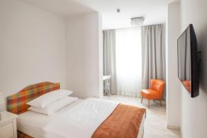 Postel nebo postele na pokoji v ubytování Werners Boutique Hotel