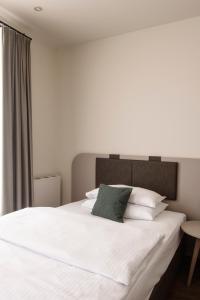 Postel nebo postele na pokoji v ubytování Werners Boutique Hotel