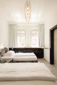 Postel nebo postele na pokoji v ubytování Werners Boutique Hotel