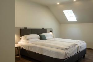 Postel nebo postele na pokoji v ubytování Werners Boutique Hotel