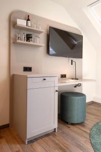 TV a/nebo společenská místnost v ubytování Werners Boutique Hotel