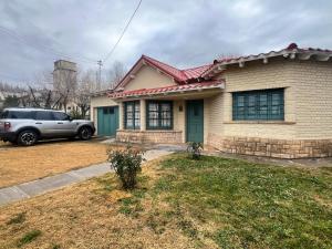 a car parked in front of a house at Casa de Campo Ana María in Tupungato