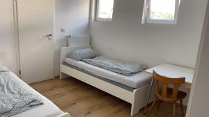 a small room with a desk and a chair at Hauptstraße 90 in Mehlingen