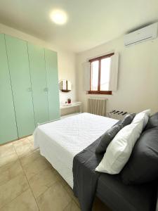 Postel nebo postele na pokoji v ubytování Appartamento Aurora Empoli - Firenze + 4 fotografie