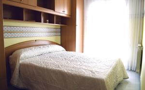 Ένα ή περισσότερα κρεβάτια σε δωμάτιο στο Casa Del Sol y la Luna Apartamento Medio Día