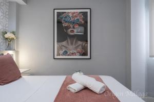 Postel nebo postele na pokoji v ubytování Xpce Malaga SOHO