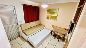 a small room with a bench and a red curtain at OFERTA - Fiori DiRoma Caldas Novas - Térreo - Parque Aquático 24h in Caldas Novas +33 photos