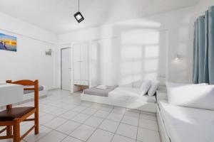 Postel nebo postele na pokoji v ubytování Kings Hersonissos Hotel
