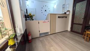 a room with a refrigerator with a referric sign on it at Motel Don Tomaso in Vaslui