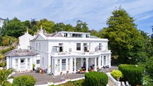 an aerial view of a white house at Vomero Holiday Apartments in Torquay