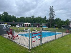 a playground with a swimming pool in a park at Mount Jefferson View in Randolph
