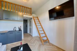 TV a/nebo společenská místnost v ubytování Industrial Apartment + 4 fotografie