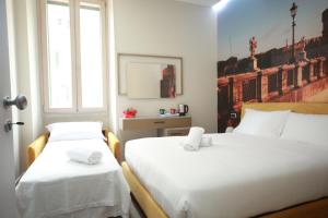 Una cama o camas en una habitación de Vacanze Romane Vaticano