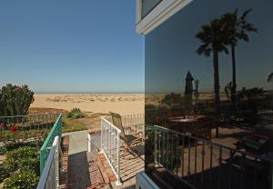a balcony of a house with a view of the beach at 1023 E Balboa B in Newport Beach