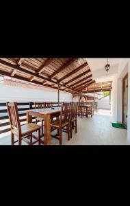 a dining room with wooden tables and chairs at Caty in Jiblea Veche