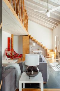 a living room with a couch and a table at Casas da Fontanheira in Marvão