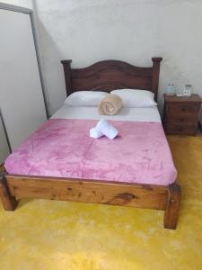 Postel nebo postele na pokoji v ubytování Casa Flórez Hotel Campestre