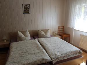 Ένα ή περισσότερα κρεβάτια σε δωμάτιο στο Ferienhaus Uckermark +14 φωτογραφίες
