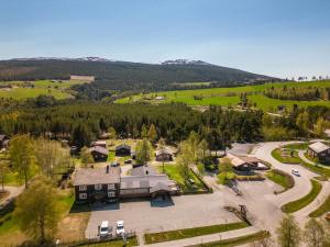 an aerial view of a house with a parking lot at Weistad in Heidal