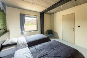 Postel nebo postele na pokoji v ubytování Boerderij63