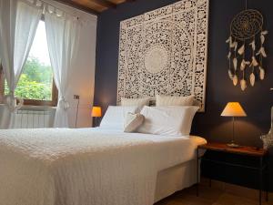 Postel nebo postele na pokoji v ubytování Le case di Lisetta Holiday homes + 37 fotografií