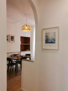 a dining room and kitchen with a dining table at Domus Taura civico 48 in Terracina