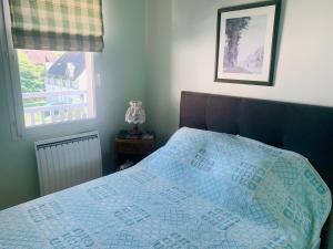 Katil atau katil-katil dalam bilik di Superbe 3 pièces Villa Les Planches Vue Mer Deauville