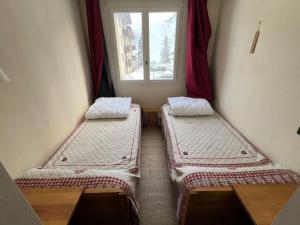 Postel nebo postele na pokoji v ubytování Praloup 1500 Appart 4 couchages