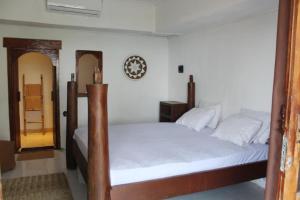 Voodi või voodid majutusasutuse Lombok Coconut Hotel toas