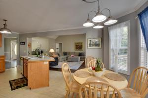 a kitchen and living room with a table and chairs at Cleveland Retreat with Deck 2 Mi to Winery! in Cleveland