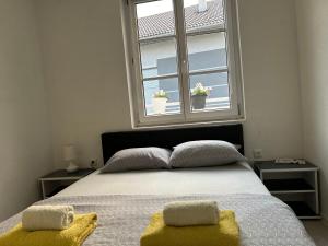 Ένα ή περισσότερα κρεβάτια σε δωμάτιο στο Apartman Jasko 2