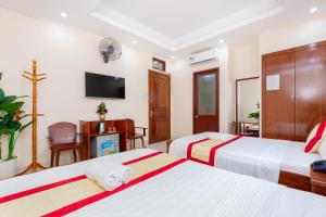 Postel nebo postele na pokoji v ubytování Biển Vàng Vũng Tàu Hotel