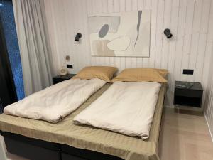 Postel nebo postele na pokoji v ubytování Tondikaku Holiday Home
