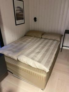 Postel nebo postele na pokoji v ubytování Tondikaku Holiday Home