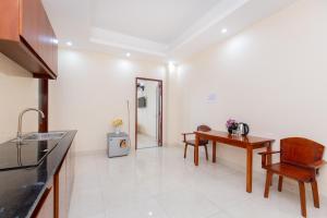 Kuchyň nebo kuchyňský kout v ubytování Biển Vàng Vũng Tàu Hotel