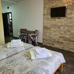 Postel nebo postele na pokoji v ubytování RA Apartmani Vrdnik