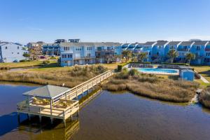 a bridge over a body of water with buildings at Bermuda Place in North Topsail Beach