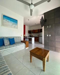 a living room with a couch and a coffee table at Melaque Paradise in San Patricio Melaque