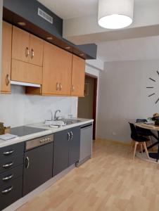 an empty kitchen with a sink and a table at Apartamento Ons in Bueu