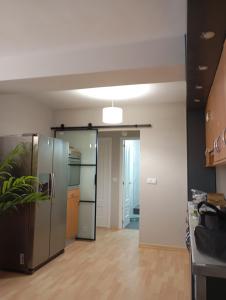 a kitchen with stainless steel appliances and a refrigerator at Apartamento Ons in Bueu