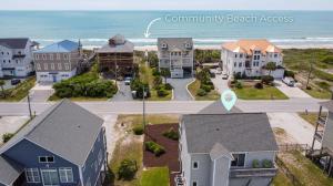 an aerial view of a residential neighborhood with the ocean at Beyond the Sea in Thomas Landing